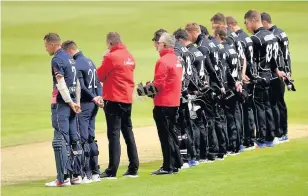  ?? Joe Giddens ?? > England and New Zealand players observe a minute’s silence ahead of the ICC Champions Trophy, match in Cardiff yesterday