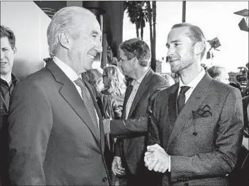  ?? Rich Fury Getty Images ?? GARY BARBER, left, shown with actor Joseph Fiennes last year, joined MGM in 2010 after its emergence from bankruptcy. Under his leadership, the studio has enjoyed a recent resurgence in the TV business.