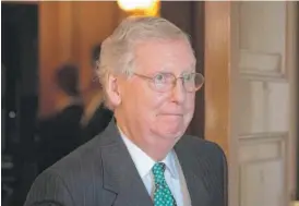  ?? DREW ANGERER/GETTY IMAGES ?? Senate Majority Leader Mitch McConnell, R-Ky., shown leaving a meeting Wednesday, said protesters won’t “scare us out of doing our duty.”