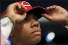  ?? THE ASSOCIATED PRESS ?? Hunter Greene, a pitcher and shortstop from Notre Dame High School in Sherman Oaks, Calif., adjusts his hat after being selected No. 2 by the Cincinnati Reds in the first round of MLB Draft June 12 in Secaucus.