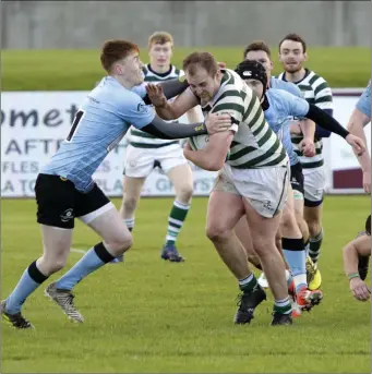  ??  ?? Michael Douglasof Greystones pushes through Rory Dempsey of Galwegians.