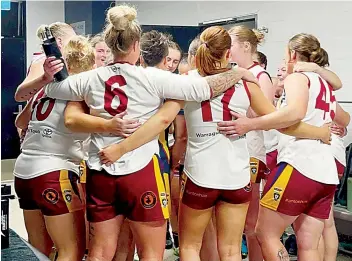  ?? ?? The Warragul Industrial­s women’s senior players sing the song their round one win over Tyabb.