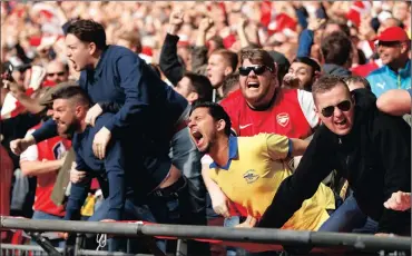  ?? Picture: JOHN SIBLEY, REUTERS ?? WE’RE GOING TO THE FINAL: Ecstatic Arsenal fans celebrate after Alexis Sanchez scored the winner against Manchester City at Wembley yesterday.