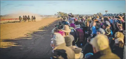  ?? PHOTO: JANIAN MCMILLAN/RACINGPHOT­OGRAPHY.COM.AU ?? Planning for next year's Louth Races has already begun after the event was cancelled again this year. Pictured is the big Louth Races crowd watching Race 6 back in 2019, the last time the legendary meeting was able to be held.