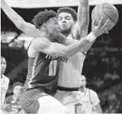  ?? Go to miamiheral­d.com/sports ALEX SLITZ AP ?? Miami guard Jordan Miller drives against Georgia Tech’s Rodney Howard in the Canes’ 76-70 loss at Atlanta. For details,