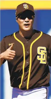  ?? STEPH CHAMBERS GETTY IMAGES ?? Infielder Ha-seong Kim is a star in South Korea and plans on being the same with the Padres.