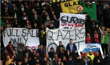 ?? Photograph: Darren Staples/AFP/Getty Images ?? Manchester United fans hold banners calling for the the Glazer family to leave the club before the Europa League quarter-final against Sevilla on 13 April.