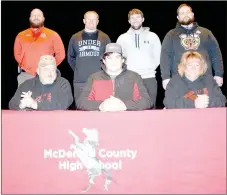  ?? RICK PECK/SPECIAL TO MCDONALD COUNTY PRESS ?? Trey Black (front row, center) recently signed a letter of intent to play football at Friends University in Wichita, Kan. Front row, left to right: Kelly Black (dad), Trey Black and Kristie Black (mom). Back row: MCHS football coaches Craig Collins,...