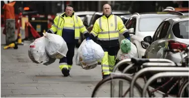  ??  ?? Council workers on duty in the city centre