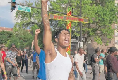  ?? COLIN BOYLE/SUN-TIMES ?? Shamare Parker of Chicago chants at the front of a shooting protest march Sunday.