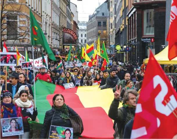  ?? (Reuters) ?? PEOPLE ATTEND a pro-Kurdish demonstrat­ion against Turkey’s military action in Syria, in Oslo.