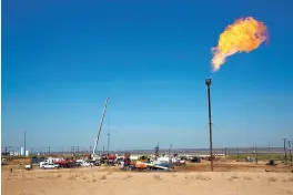  ?? ROBIN ZIELINSKI/THE LAS CRUCES SUN NEWS VIA AP ?? A well-flare burns on the southwest corner of the Smith Ranch. Kenneth Smith Inc. continues to be responsibl­e for the grazing fees associated with the lands, even though vegetation now longer grows there.