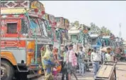  ?? PTI ?? Trucks parked at Azadpur Mandi in New Delhi on Monday during a nationwide strike.