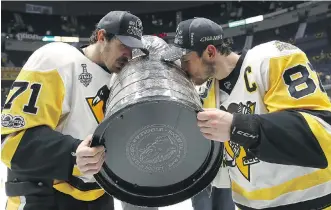  ?? BRUCE BENNETT/GETTY IMAGES FILES ?? With back-to-back Stanley Cups to the team’s name, Evgeni Malkin and Sidney Crosby will now try to make the Pittsburgh Penguins the first club to win three straight since the 1980s.