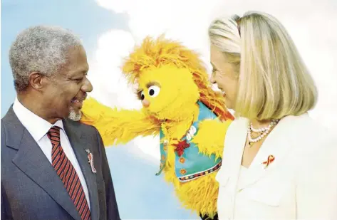  ??  ?? Annan – then UN secretary general – and his wife Nane do a skit with an Hiv-positive Muppet on the South African version of Sesame Street