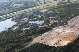  ?? Gerald Herbert / Associated Press 2013 ?? The Six Flags amusement park in New Orleans has never reopened since it was submerged by Hurricane Katrina in 2005. The site may be demolished.