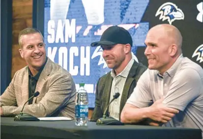  ?? KEVIN RICHARDSON/BALTIMORE SUN ?? Ravens punter Sam Koch, center, announced his retirement Thursday after 16 seasons in Baltimore. He was joined by executive vice president and general manager Eric DeCosta, right, and head coach John Harbaugh, left, at the Under Armour Performanc­e Center.