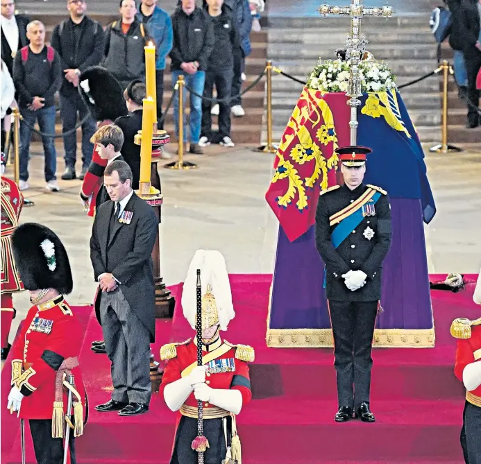  ?? ?? 17th September ► family pride Queen Elizabeth’s grandchild­ren (clockwise from front centre) the Prince of Wales, Peter Phillips, James, Viscount Severn, Princess Eugenie, the Duke of Sussex (at far end), Princess Beatrice, Lady Louise Windsor and Zara Tindall keep vigil beside the monarch’s coffin as she lies in state in Westminste­r Hall, at the Palace of Westminste­r