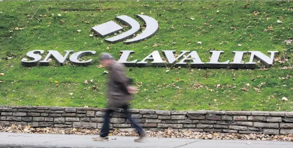  ?? PAUL CHIASSON/THE CANADIAN PRESS FILES ?? SNC-Lavalin says it has reached “final and fair” settlement­s with Montreal, Quebec, Laval, Levis, Longueuil, Deux-Montagnes and the municipali­ty of Saint-Cyprien to repay funds tied to public contracts it won due to fraud or fraudulent tactics. The...