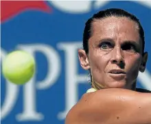  ?? TIMOTHY A. CLARY/GETTY IMAGES ?? Roberta Vinci of Italy hits a return against Anna-Lena Friedsam of Germany during their U.S. Open singles match Monday.