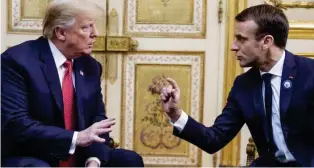  ?? - AFP ?? ENGROSSED: US President Donald Trump speaks with French President Emmanuel Macron prior to their meeting at the Elysee Palace in Paris, on November 10, 2018, on the sidelines of commemorat­ions marking the 100th anniversar­y of the 11 November 1918 armistice, ending World War I.