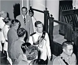  ??  ?? Carruthers, followed by the governor, Sir William Goode, in the Singapore Legislativ­e Assembly