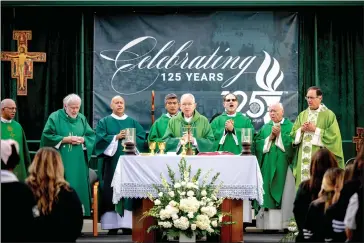  ?? PHOTOS BY WATCHARA PHOMICINDA — STAFF PHOTOGRAPH­ER ?? Archbishop José H. Gómez, center, celebrates Mass with clergy joining him Friday for the 125th anniversar­y of Pomona Catholic High School. The school establishe­d in 1898 was also the Academy of the Holy names and St. Joseph High School.
