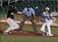  ?? RANDY MEYERS — FOR THE MORNING JOURNAL ?? Bryan Flete of Southern Illinois steps back to first base before the catch is made by Crushers first baseman Steve Passatempo on Aug. 24.