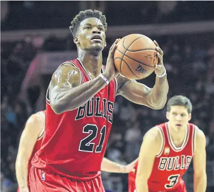  ??  ?? Bulls guard Jimmy Butler shoots from the foul line during the game against the 76ers.