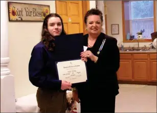  ?? Submitted photo ?? Douglas Middle School Student Bryan Grady, left, receiving his American History Medal and Certificat­e from Anne Marie Safaee, regent of the Captain Job Knapp Chapter of the DAR.