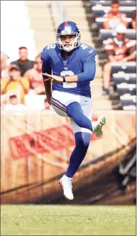  ?? Kirk Irwin / Associated Press ?? New York Giants punter Ryan Santoso kicks the ball during a game against the Cleveland Browns on Sunday.