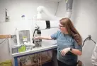  ?? ?? Lab Director Abigail Burkhart talks about testing equipment inside The Highgrade Testing Lab in Oklahoma City July 22.