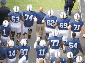  ?? BARRY REEGER/AP ?? Penn State head coach James Franklin leads the Nittany Lions onto the field for their game against Idaho on Aug. 31. Several Penn State players have posted a letter purportedl­y sent after the game complained about a player’s hair.