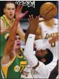  ?? MARK J. TERRILL – AP ?? The Lakers’ Andre Drummond, right, shoots as he’s defended by Ersan Ilyasova of the Jazz.