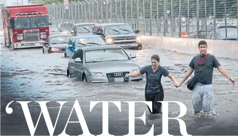  ?? FRANK GUNN/THE CANADIAN PRESS FILE PHOTO ?? The Islands deluge and the torrent in July 2013 are the type of flooding Ontarians can expect to see more of due to a decline in green space.