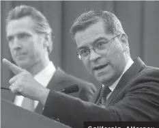  ?? ASSOCIATED PRESS ?? California Attorney General Xavier Becerra, right, accompanie­d by Gov. Gavin Newsom, said California was probably suing President Donald Trump over his emergency declaratio­n to fund a wall on the U.S.-Mexico border in Sacramento, Calif.