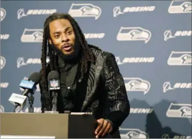 ?? THE ASSOCIATED PRESS FILE ?? Seahawks cornerback Richard Sherman talks to reporters during a post-game press conference following a game against the Texans, in Seattle. The Seahawks are cutting ties with Sherman after seven seasons.