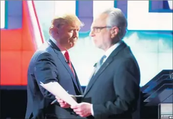  ?? Justin Sullivan Getty Images ?? PRESIDENT Trump’s White House had viewers tuned in. Top, MSNBC’s Rachel Maddow with late-night TV host Stephen Colbert. Above, Trump walks past CNN anchor Wolf Blitzer at a GOP debate in 2015.