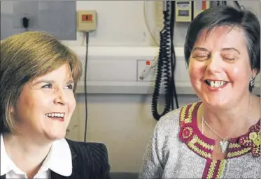  ?? Pictures: PA ?? Above – Nicola Sturgeon chats with Sylvia Paton who has had the stem cell treatment. Right – Sylvia has her cornea checked.