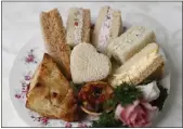  ??  ?? My Lady’s Respite afternoon tea features a scone, tea sandwiches and a dessert.