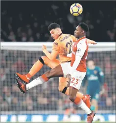  ??  ?? Liverpool’s Alex Oxlade-Chamberlai­n challenges his former Arsenal teammate Danny Welbeck. — Reuters photo