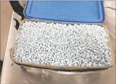  ?? DRUG ENFORCEMEN­T ADMINISTRA­TION VIA AP ?? THIS PHOTO PROVIDED by the U.S. Drug Enforcemen­t Administra­tion’s Phoenix Division shows one of four containers holding some of the 30,000 fentanyl pills the agency seized in one of its bigger busts in Tempe in August 2017. “Even the smallest amount of the opioid can be enough to kill a person,” says Lt. Marco Santana, spokesman for San Luis Police Department.