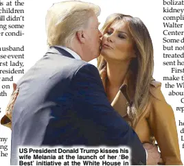  ??  ?? US President Donald Trump kisses his wife Melania at the launch of her ‘Be Best’ initiative at the White House in Washington on May 7.