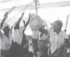  ??  ?? Women display their handicraft­s as they sing and dance during a function organised by Lupane Women’s Centre in Siachilaba, Binga, recently