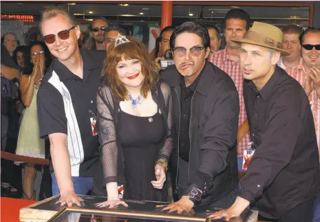  ?? Vince Bucci / Getty Images 2002 ?? Billy Zoom (left), Exene Cervenka, John Doe and D.J. Bonebrake of X. Zoom is fighting bladder cancer.