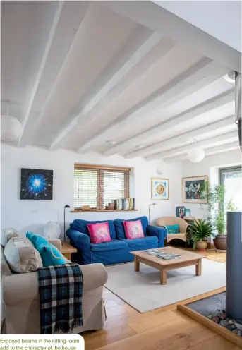  ??  ?? Exposed beams in the sitting room add to the character of the house