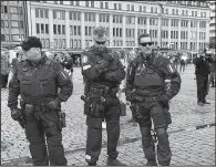  ?? AP/VESA MOILANEN ?? Police patrol Saturday in the market square of Turku, Finland, after Friday’s attack there.