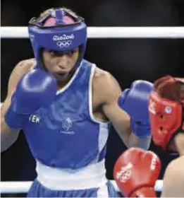  ??  ?? Estelle Mossely, concepteur-developpeu­r chez Allianz et championne olympique de boxe.