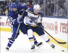  ?? CP PHOTO ?? St. Louis Blues centre Paul Stastny battles with Toronto Maple Leafs defenceman Nikita Zaitsev for the puck during a regular-season game. The Maple Leafs won’t have Zaitsev for Game 1 of their first-round playoff series against Washington.