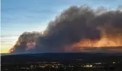  ?? ALBUQUERQU­E JOURNAL ROBERT BROWMAN / THE ?? Smoke from the Calf Canyon/Hermits Peak Fire drifts over Las Vegas, N.M., on Saturday.